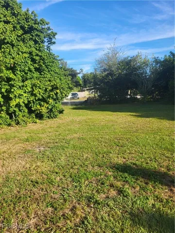 a view of a lake with a yard