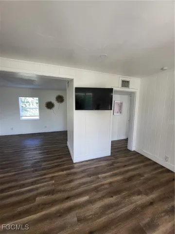a view of a livingroom with wooden floor