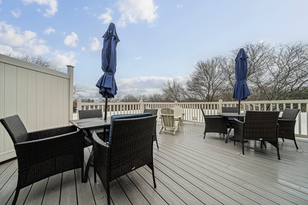 7 Beech Street, Unit 319 Cambridge, MA 02140 - Photo 19 of 27 a roof deck with table and chairs