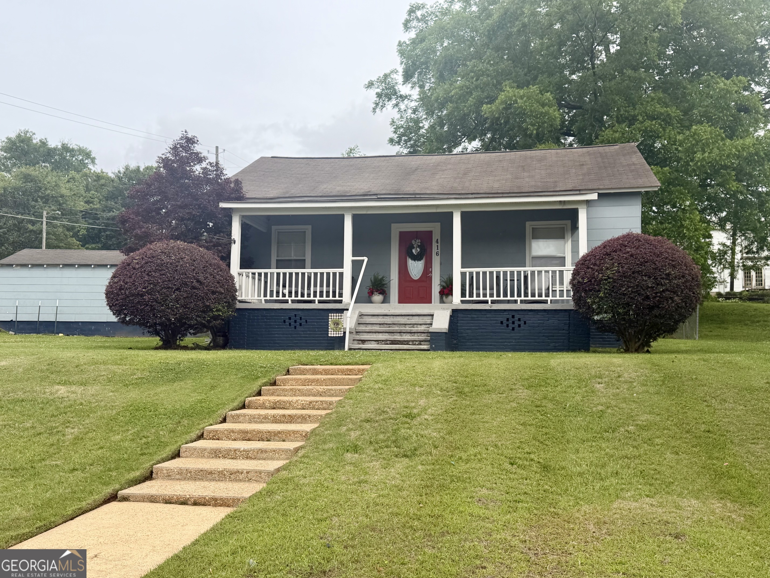 416 Bailey Street Valley, AL 36854 - Photo 1 of 24 a house view with a garden space