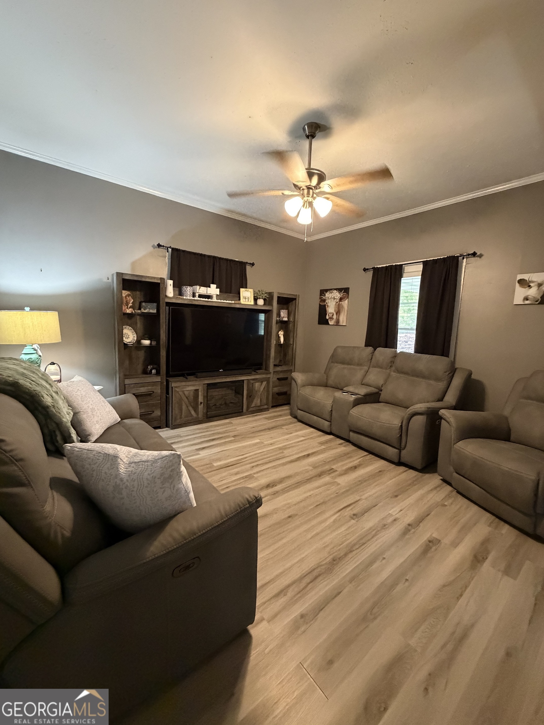 416 Bailey Street Valley, AL 36854 - Photo 14 of 24 a living room with furniture a ceiling fan and a flat screen tv