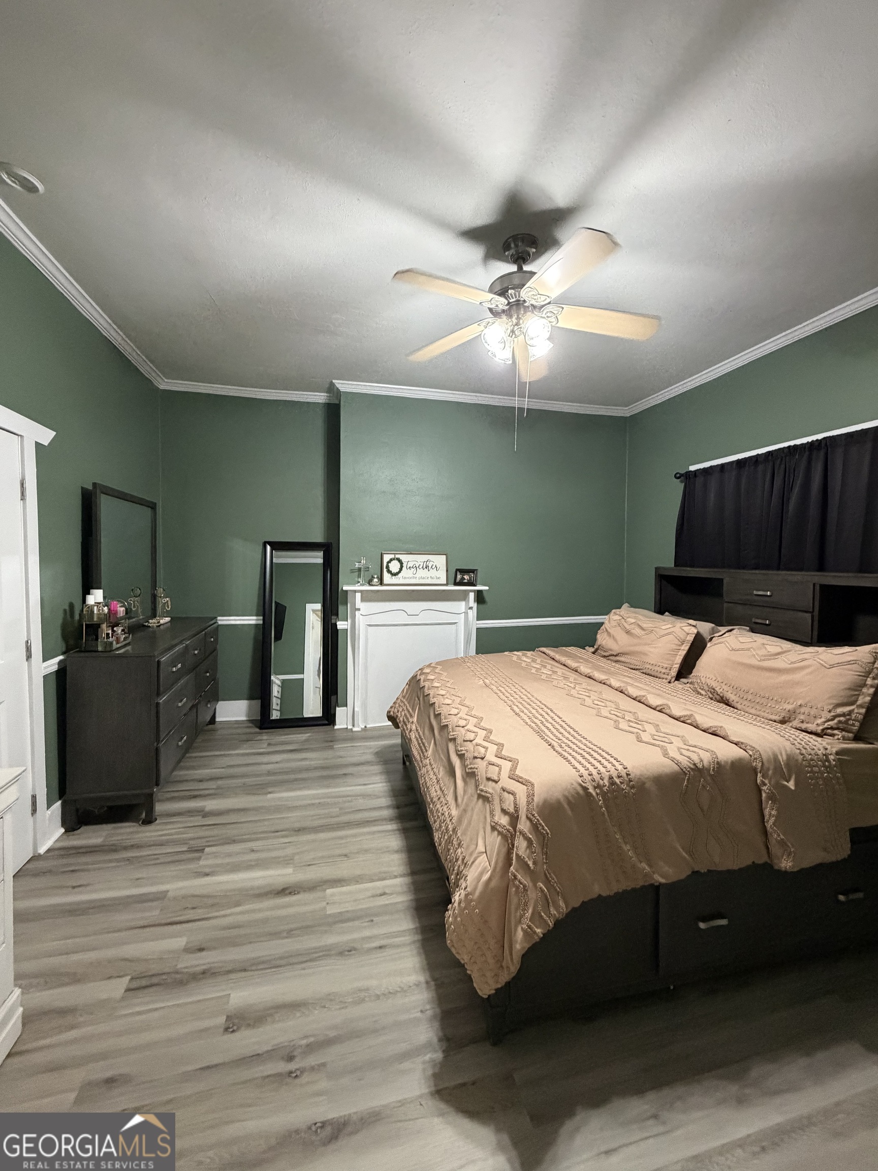416 Bailey Street Valley, AL 36854 - Photo 22 of 24 a bedroom with a bed and a chandelier