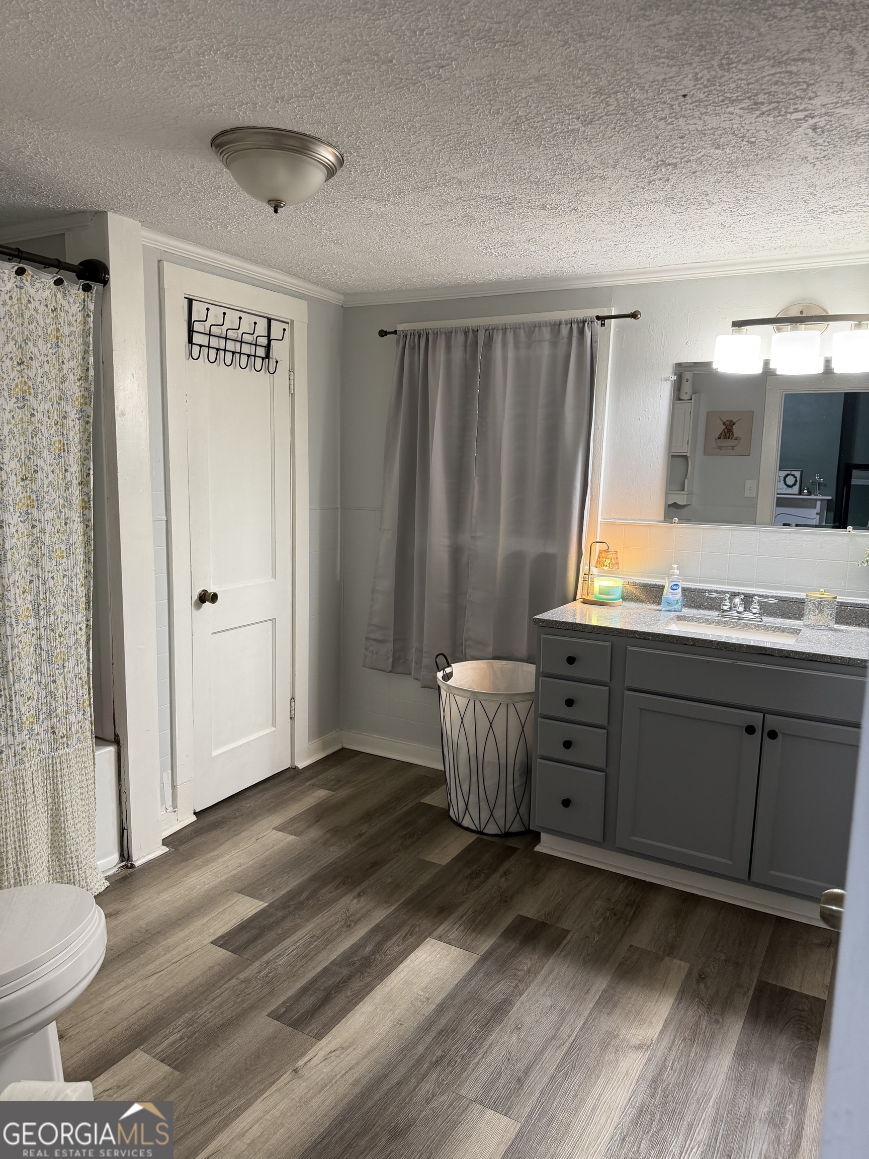 416 Bailey Street Valley, AL 36854 - Photo 23 of 24 a view of a bathroom with sink toilet and wooden floor