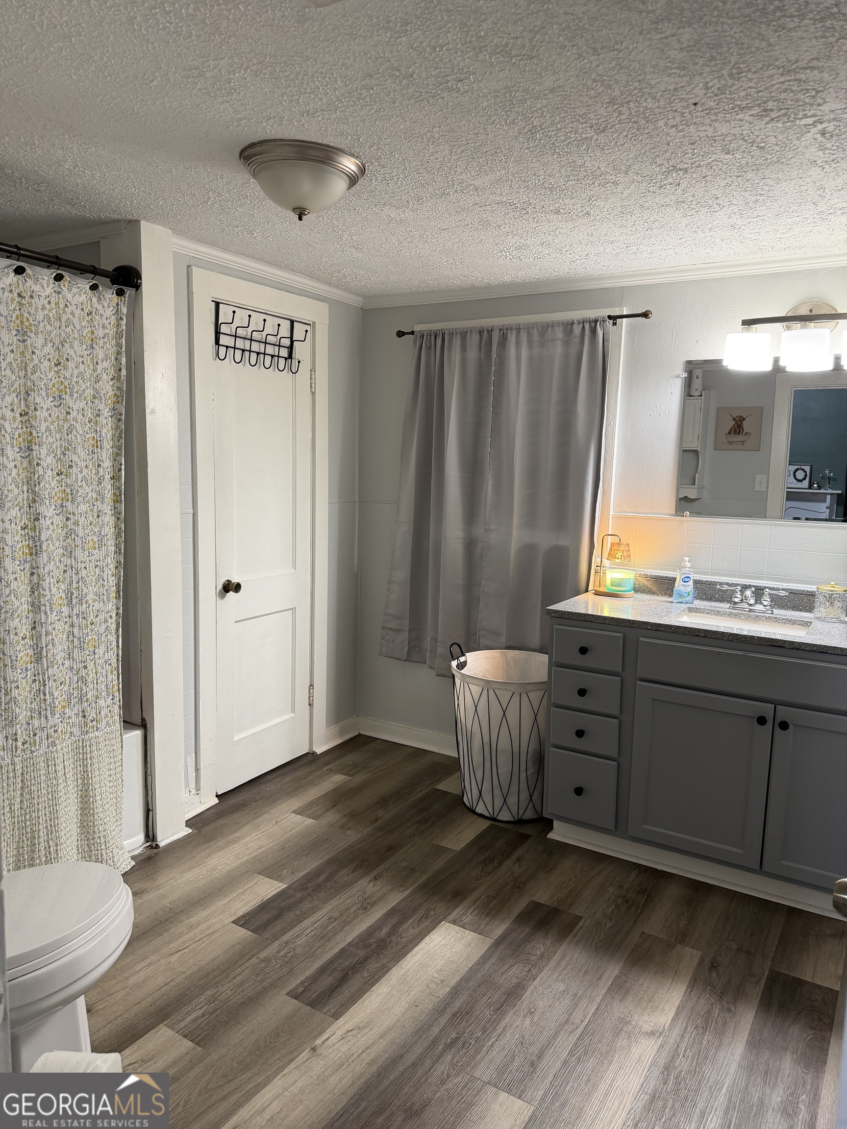 416 Bailey Street Valley, AL 36854 - Photo 24 of 24 a bedroom with a bed and a mirror on the dresser