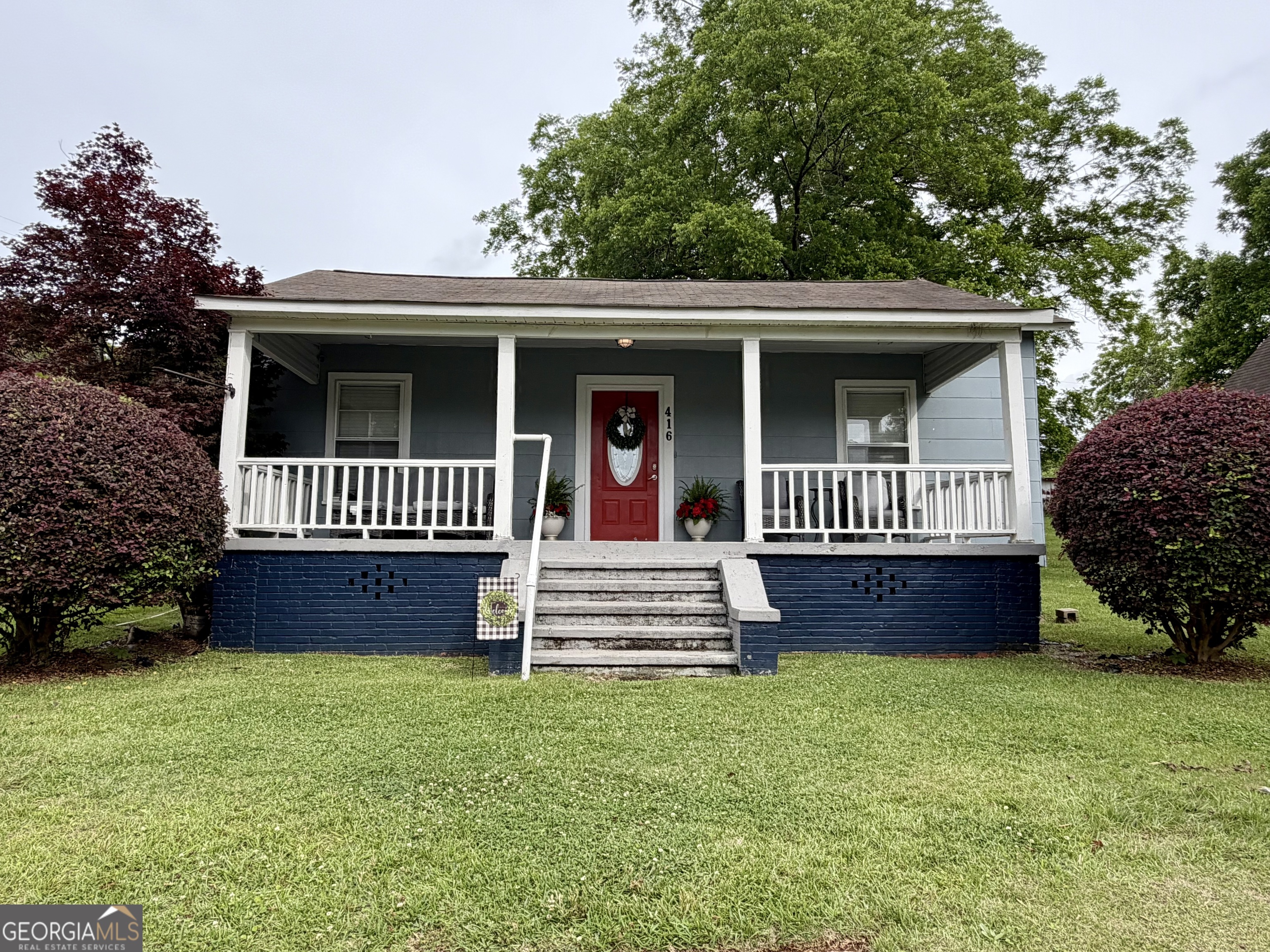 416 Bailey Street Valley, AL 36854 - Photo 4 of 24 a front view of a house with a garden