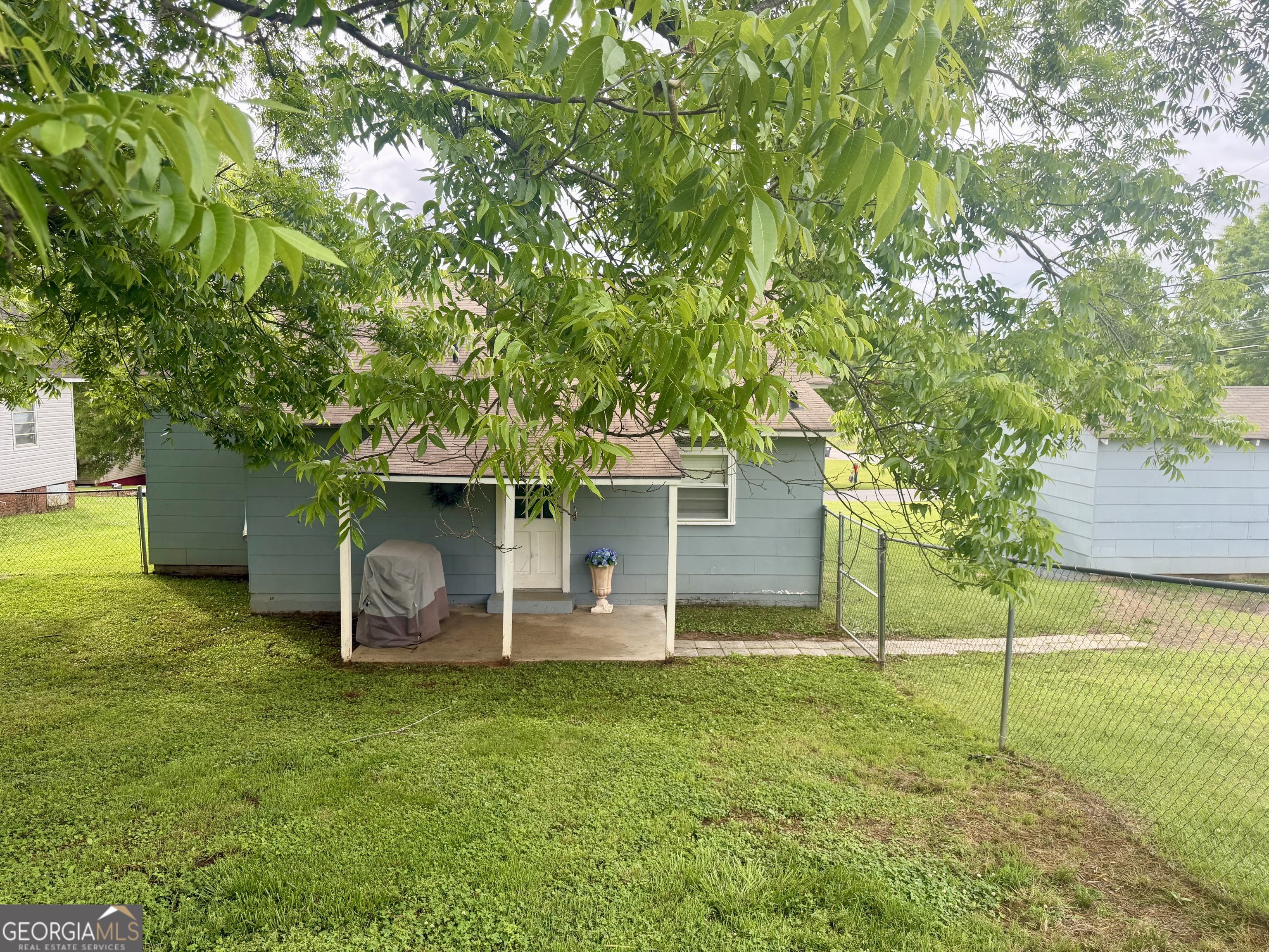 416 Bailey Street Valley, AL 36854 - Photo 6 of 24 a view of a backyard with table and chairs and potted plants