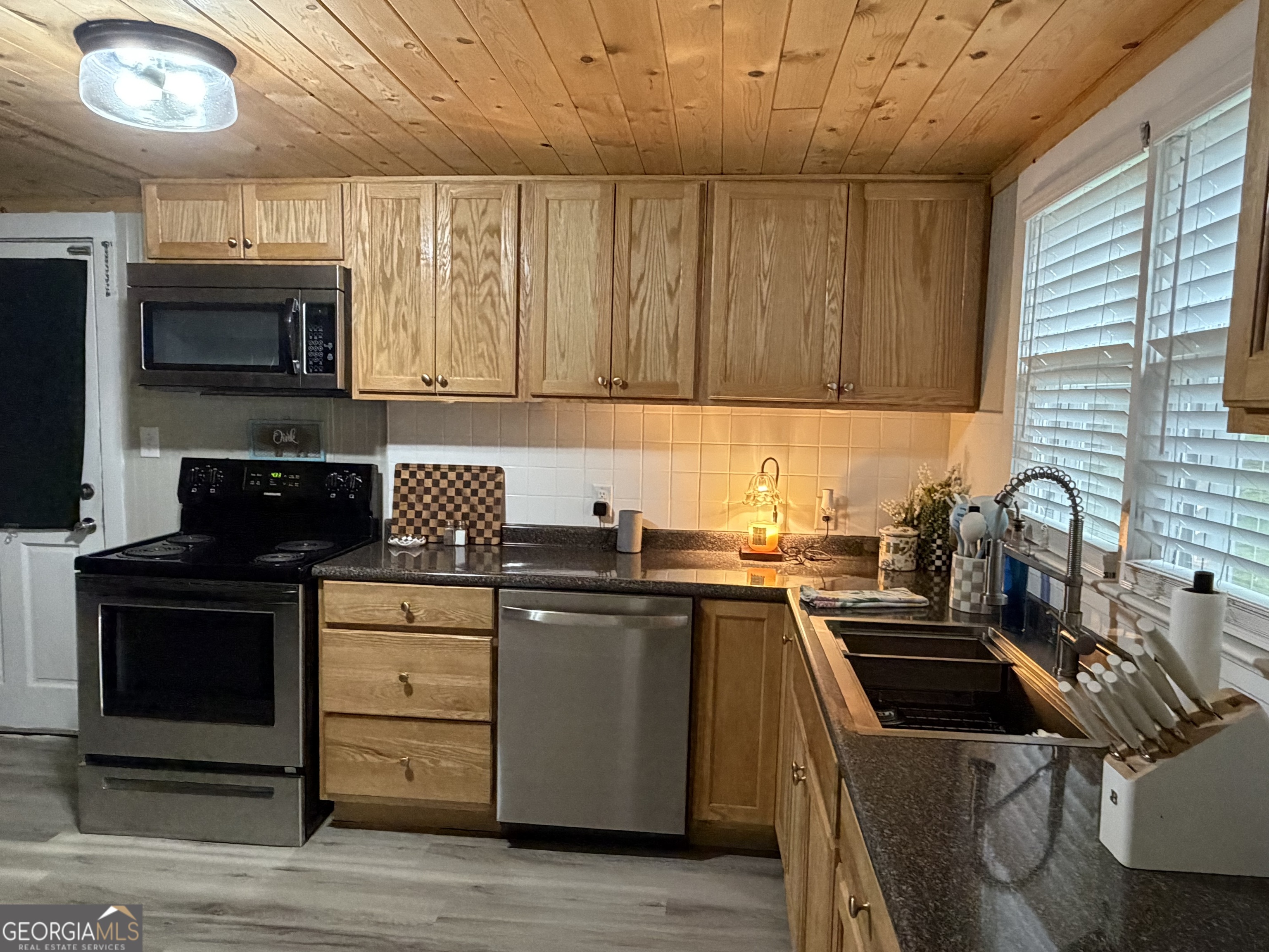 416 Bailey Street Valley, AL 36854 - Photo 10 of 24 a kitchen with a sink a stove and cabinets