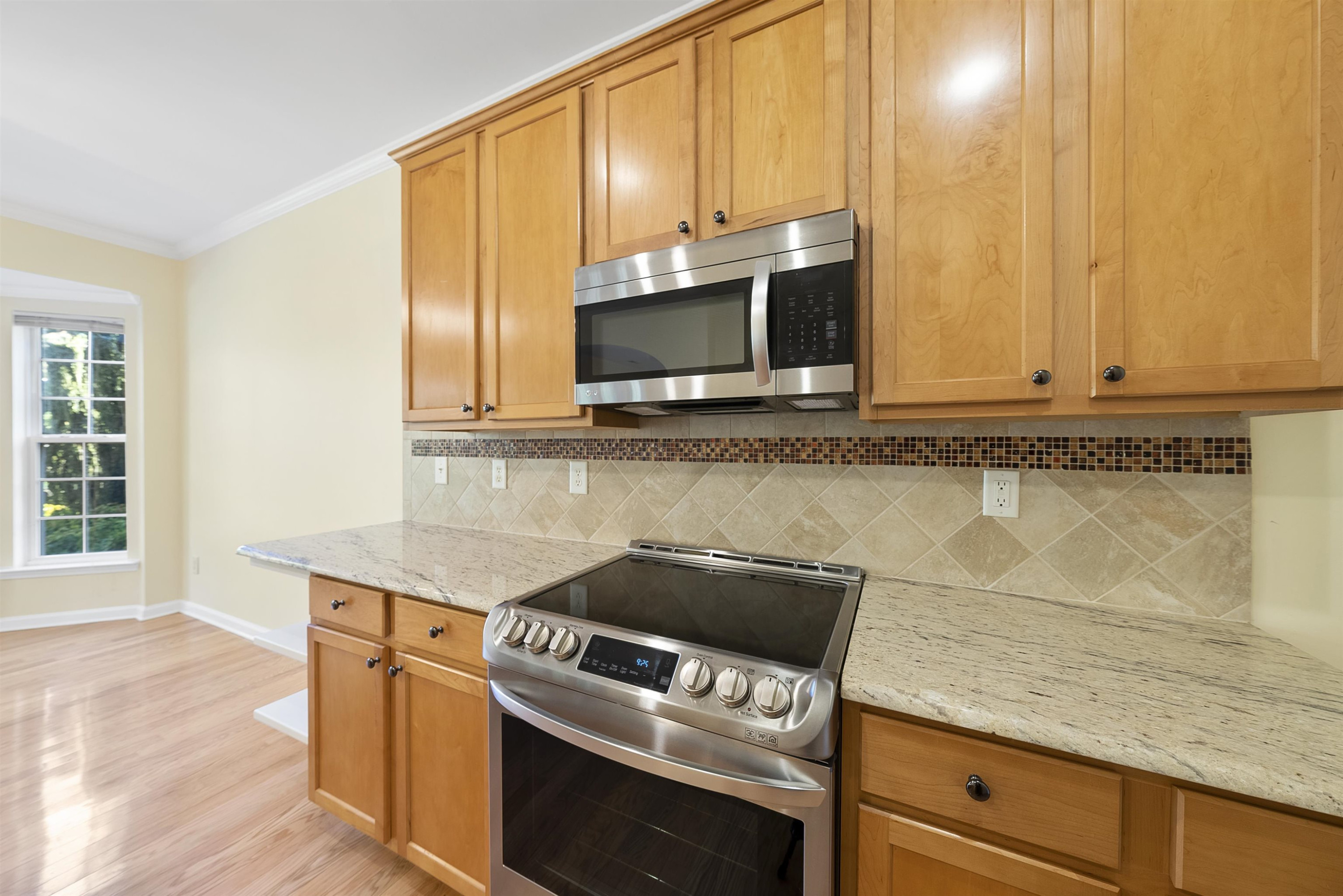 8408 Tie Stone Way Raleigh, NC 27613 - Photo 11 of 33 Updated with granite countertops and new appliances Kitchen