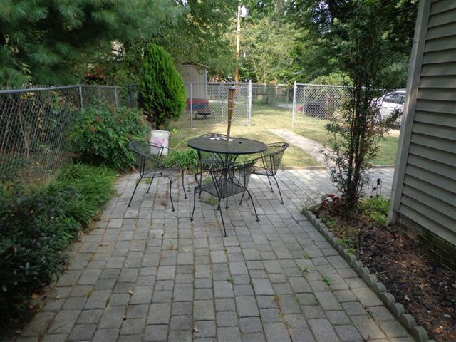 109 Riverside Drive Columbia, TN 38401 - Photo 18 of 20 This stone walkway leads around to a patio area in back.