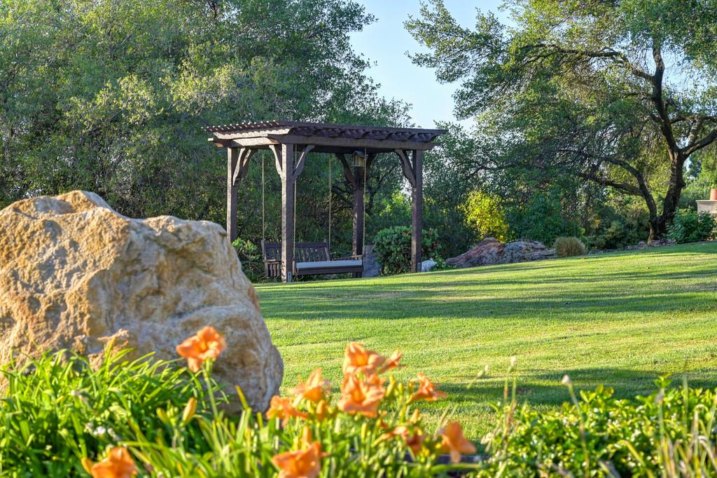 5144 Prior Ridge Granite Bay, CA 95746 - Photo 1 of 11 a view of a garden with a swimming pool