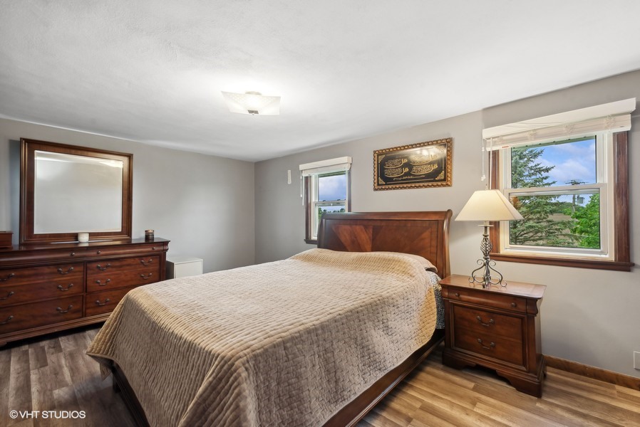 11719 Engelhardt Road Harvard, IL 60033 - Photo 12 of 18 a bedroom with double bed and a window