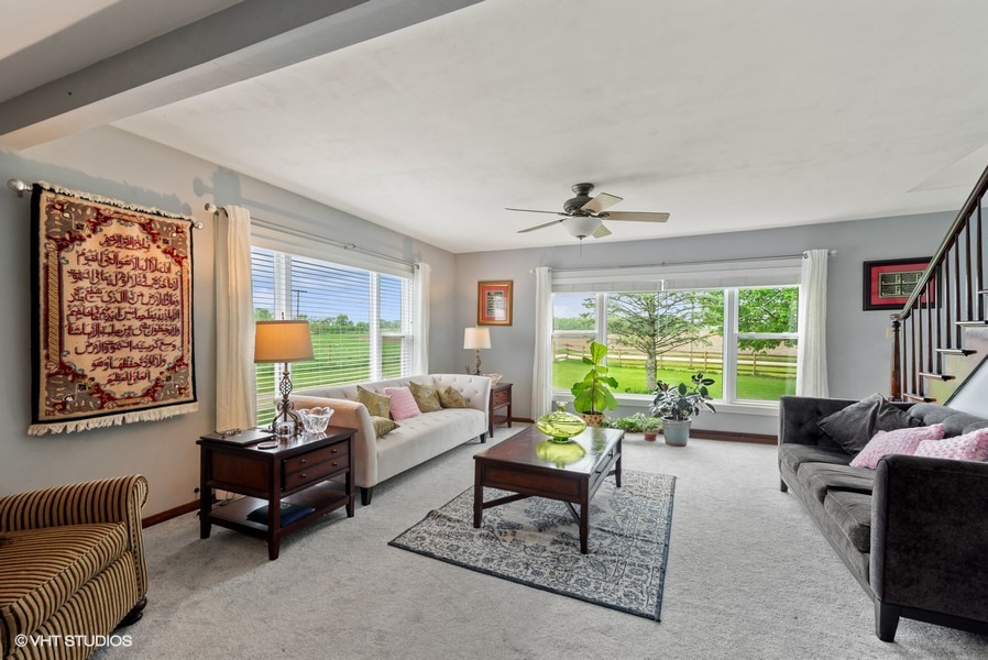 11719 Engelhardt Road Harvard, IL 60033 - Photo 2 of 18 a living room with furniture and a large window
