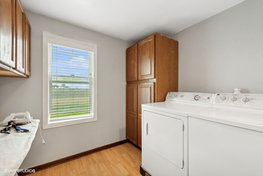 11719 Engelhardt Road Harvard, IL 60033 - Photo 8 of 18 a utility room with dryer and washer