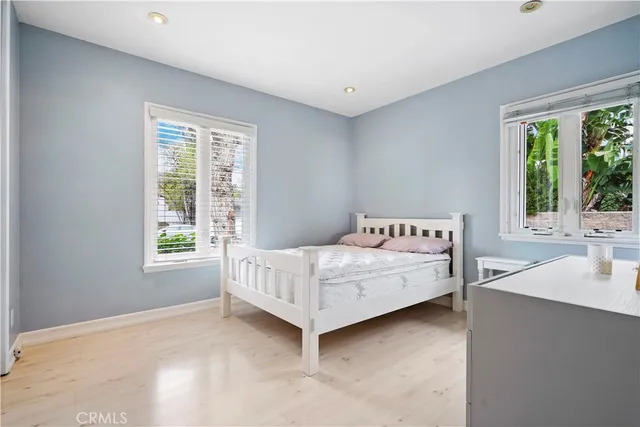 a bedroom with a bed and a table