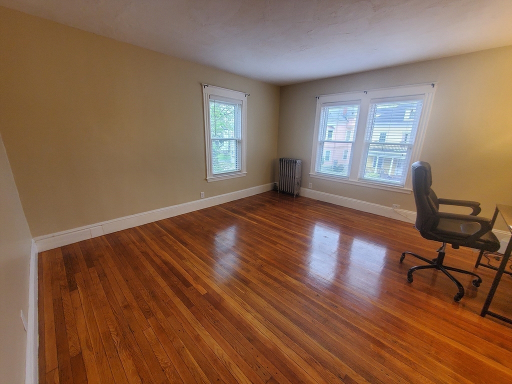 45 Intervale Street, Unit 2 Boston, MA 02121 - Photo 8 of 17 a view of a room with wooden floor lounge chair and windows
