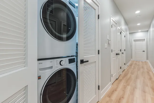 a view of a hallway with washer and dryer