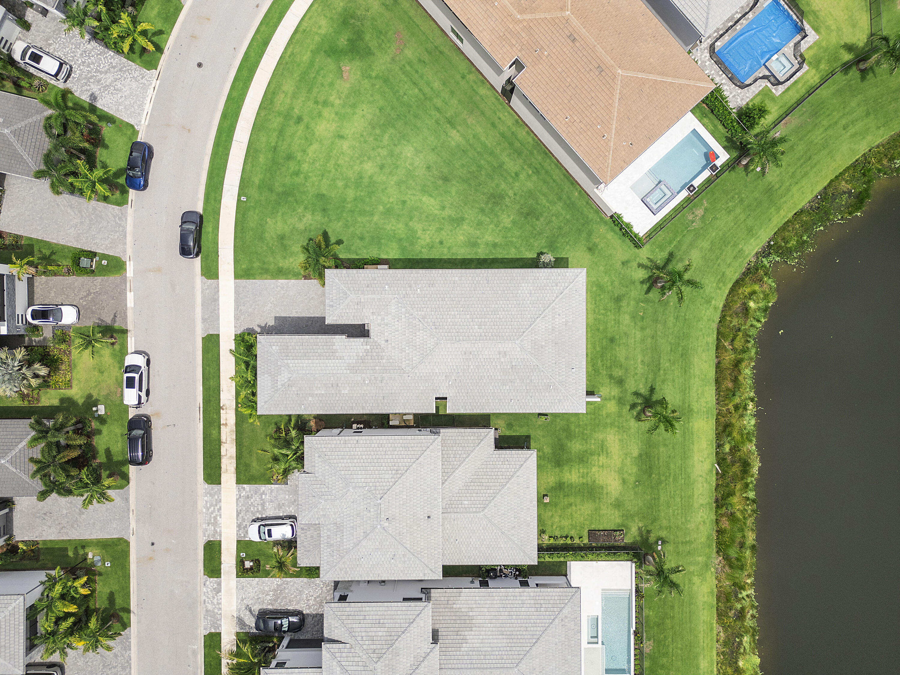 9322 Sunflower Mdw Road Boca Raton, FL 33434 - Photo 69 of 87 an aerial view of a house with a garden and trees