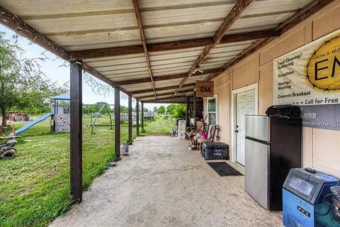 a view of a garage with wooden floor