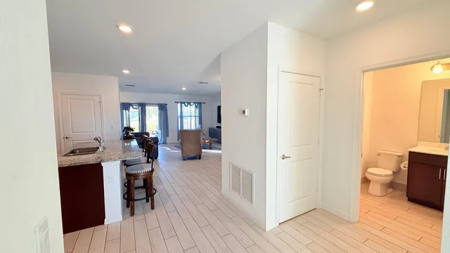 a bathroom with a toilet a sink and bathtub
