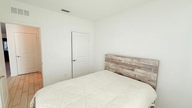 a kitchen with granite countertop kitchen island stainless steel appliances a sink and living room view