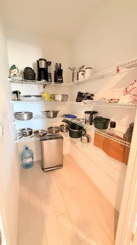 a kitchen with granite countertop a refrigerator stove and microwave