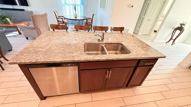 a bedroom with a sink and a mirror