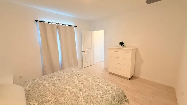 a bathroom with a shower and a toilet