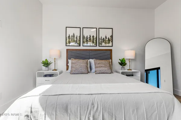a bedroom with a bed and a dresser