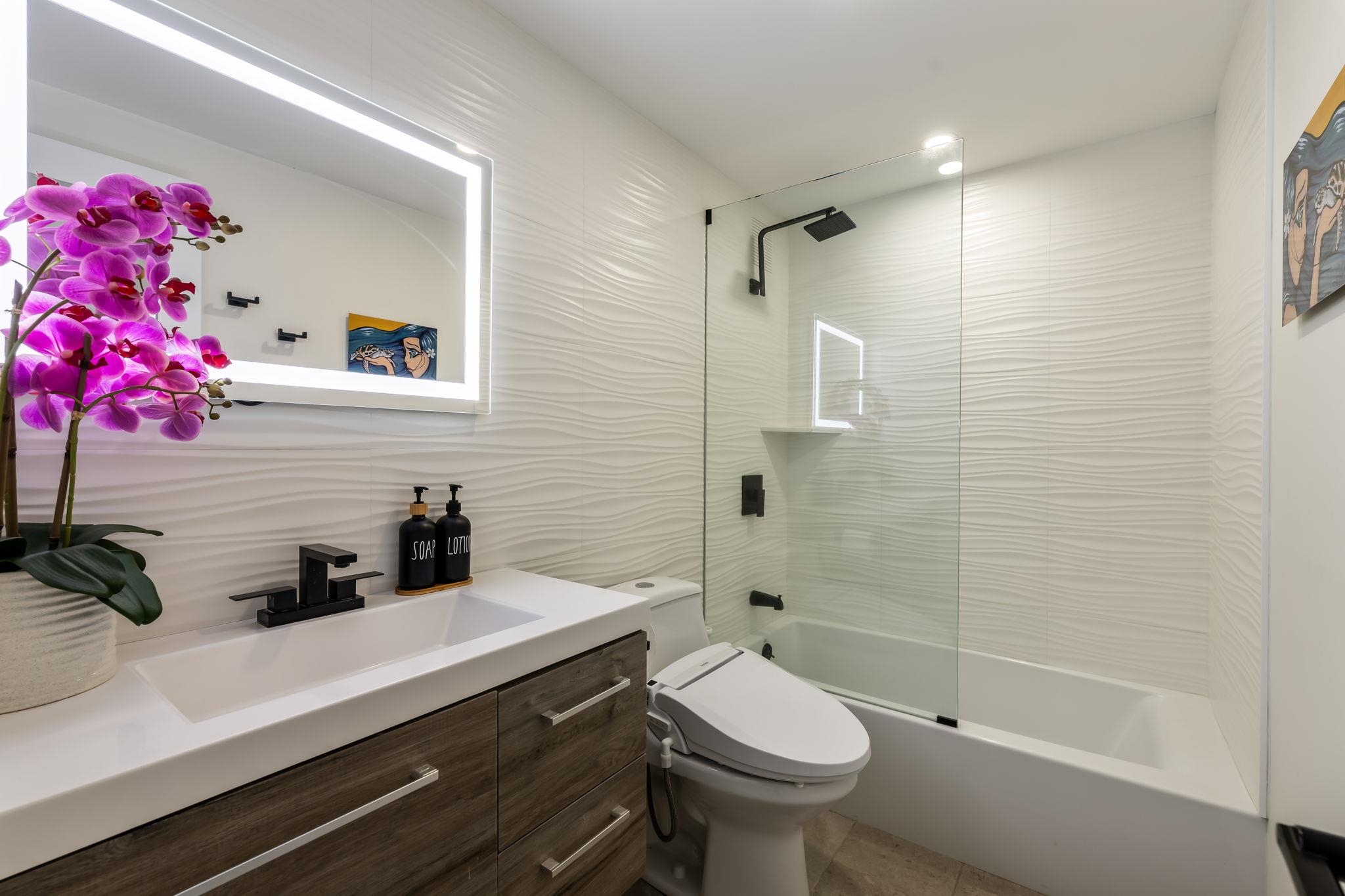 760 South Kihei Road, Unit 208 Kihei, HI 96753 - Photo 11 of 30 a bathroom with a sink a toilet and shower