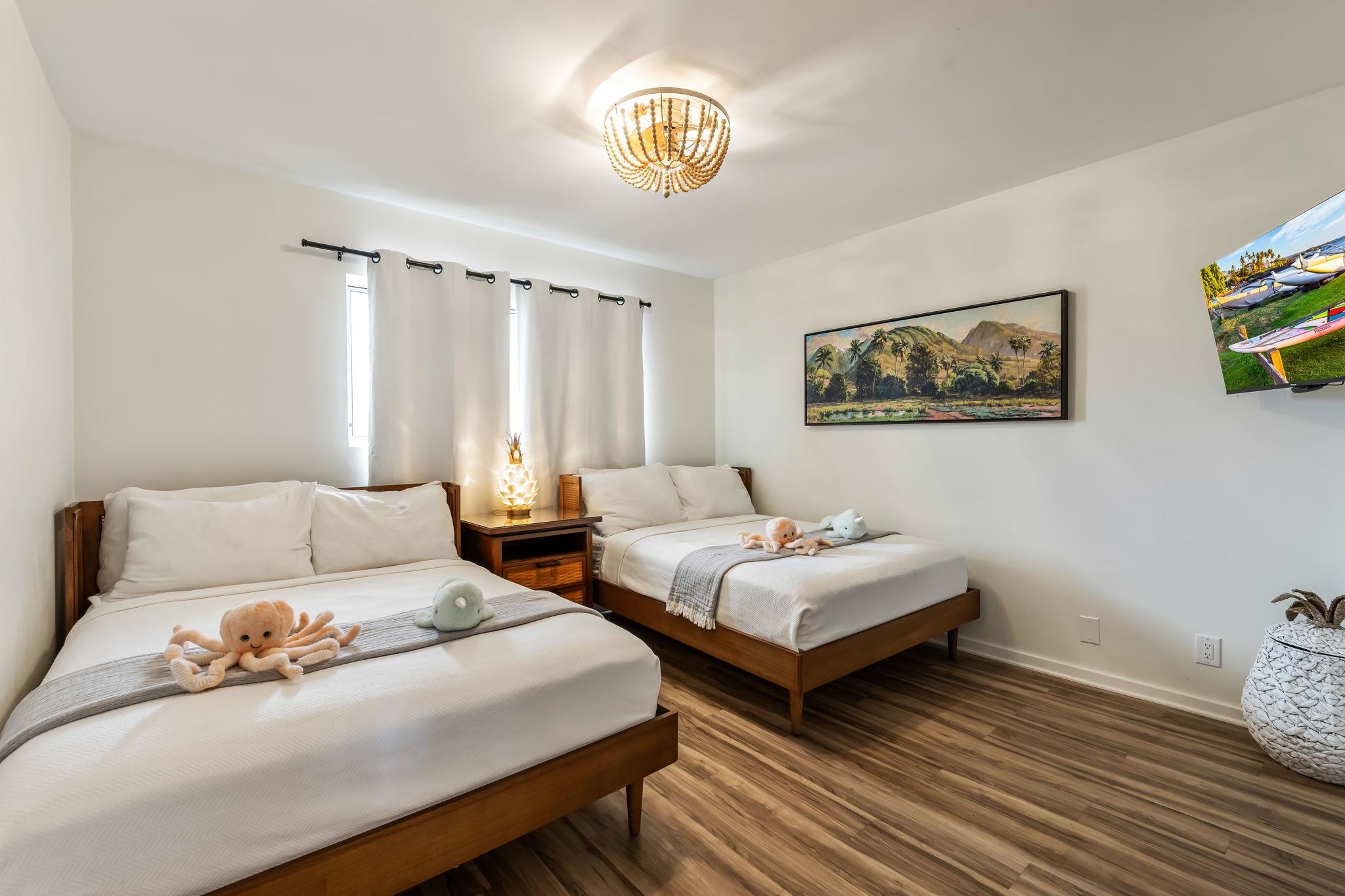 760 South Kihei Road, Unit 208 Kihei, HI 96753 - Photo 12 of 30 a bedroom with two beds and painting on the wall