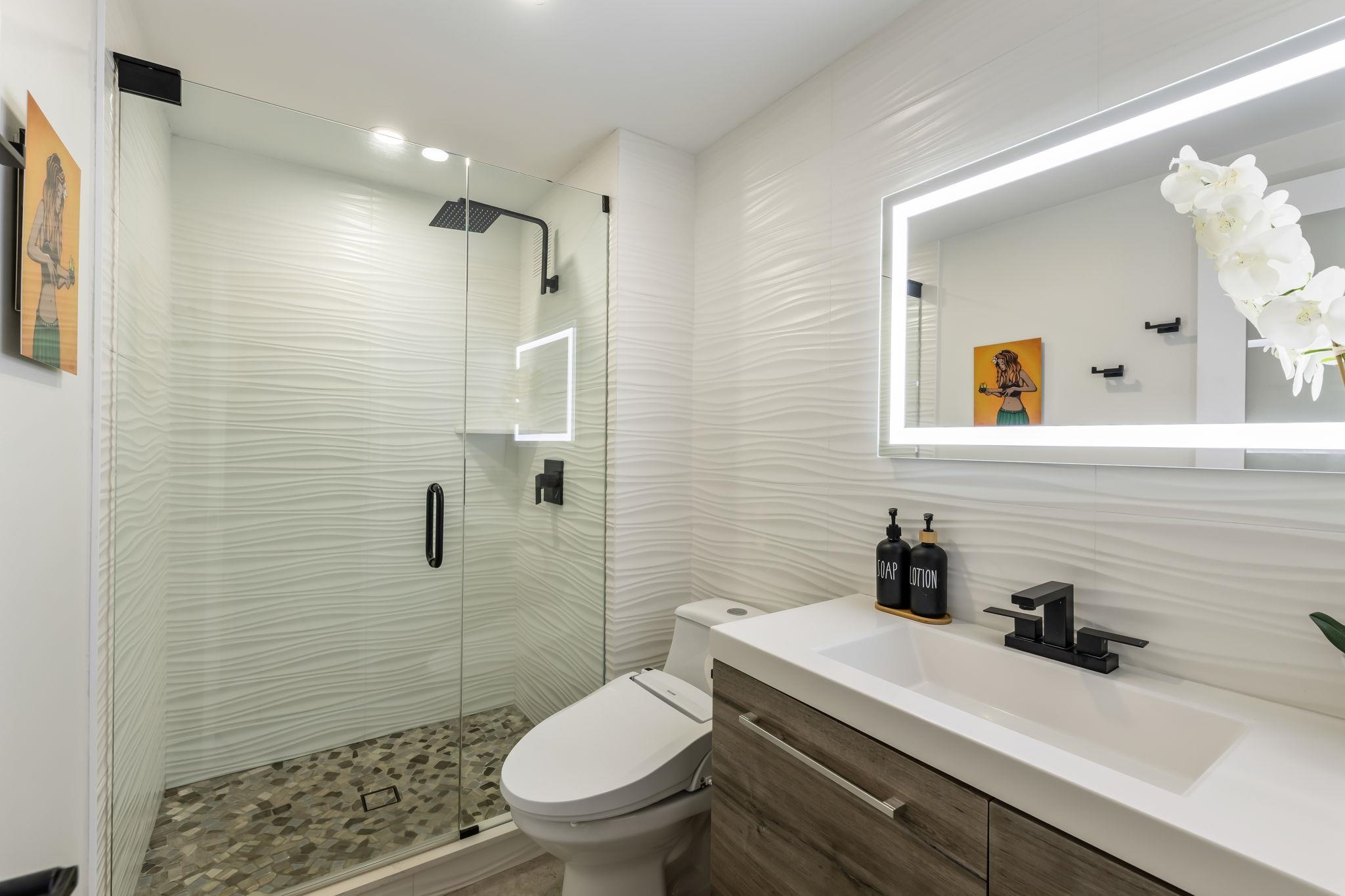 760 South Kihei Road, Unit 208 Kihei, HI 96753 - Photo 14 of 30 a bathroom with a sink a toilet and shower