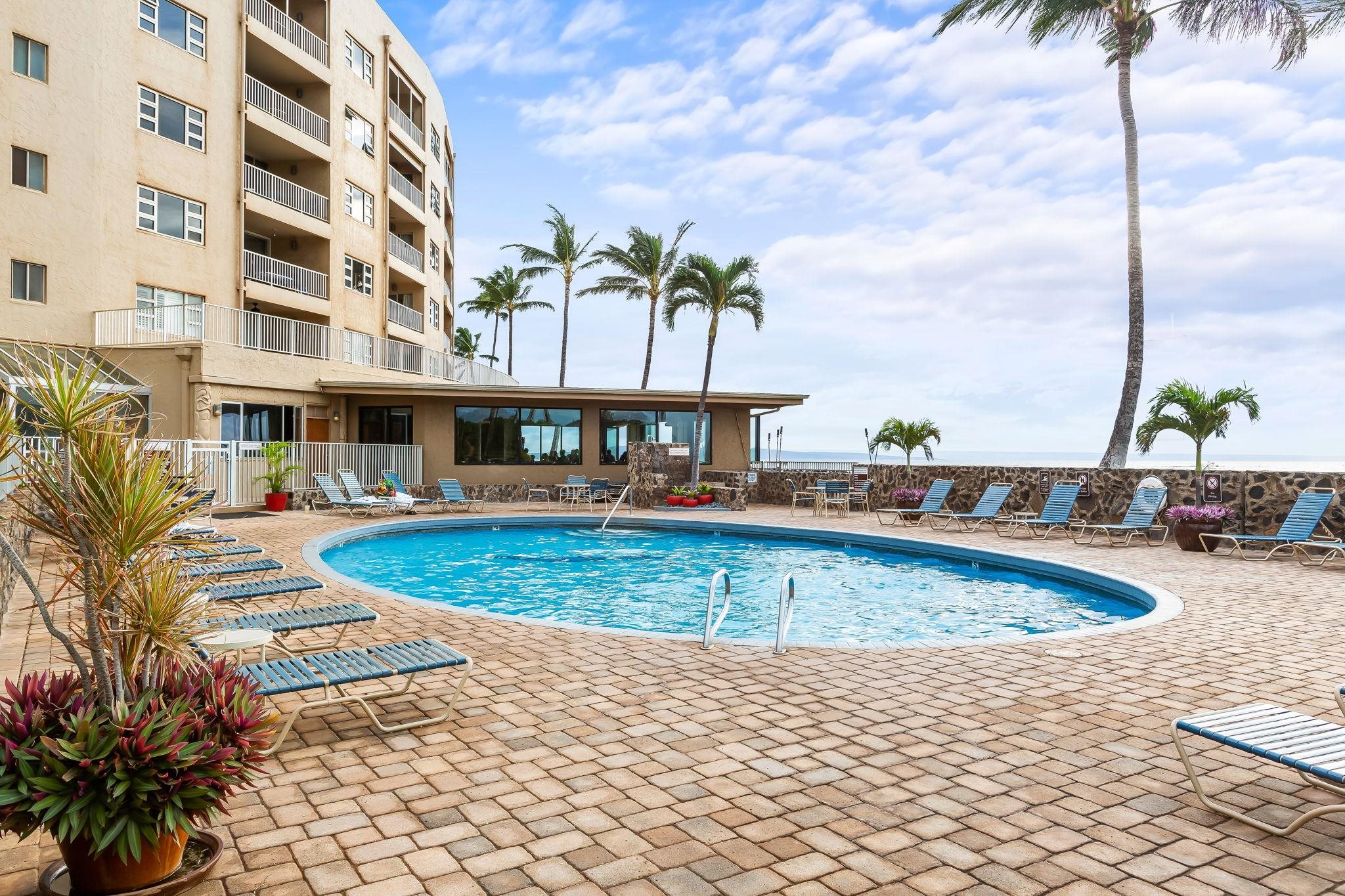 760 South Kihei Road, Unit 208 Kihei, HI 96753 - Photo 17 of 30 a view of a swimming pool with a lounge chairs