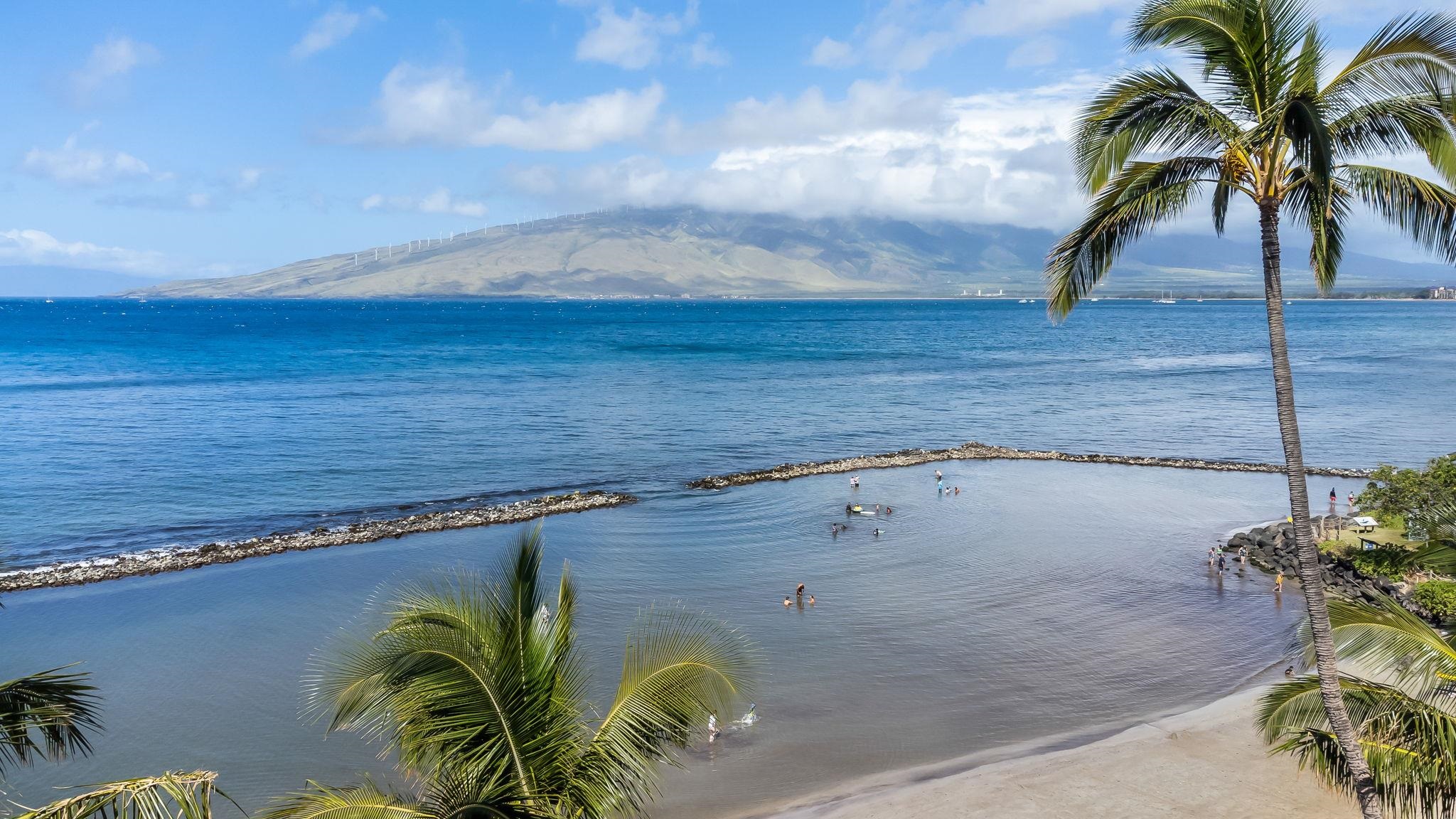 760 South Kihei Road, Unit 208 Kihei, HI 96753 - Photo 23 of 30 a view of a swimming pool with a table and chair