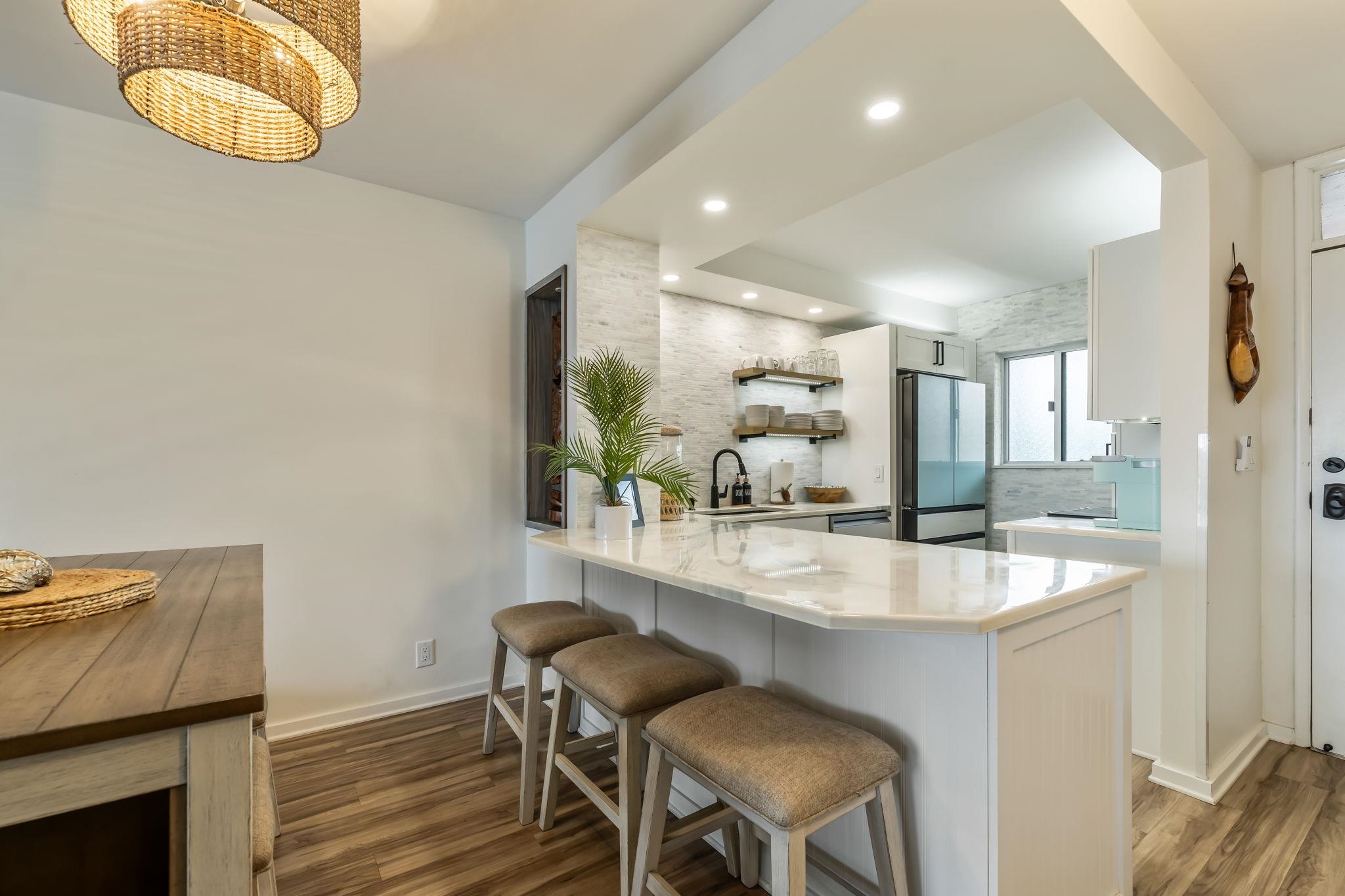 760 South Kihei Road, Unit 208 Kihei, HI 96753 - Photo 5 of 30 a dining room with table and chairs
