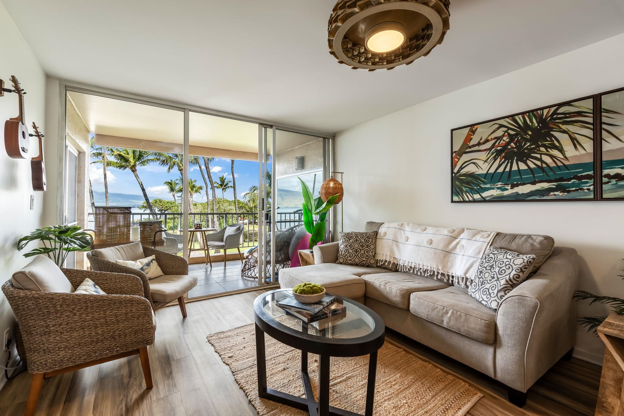 760 South Kihei Road, Unit 208 Kihei, HI 96753 - Photo 6 of 30 a living room with furniture and a large window
