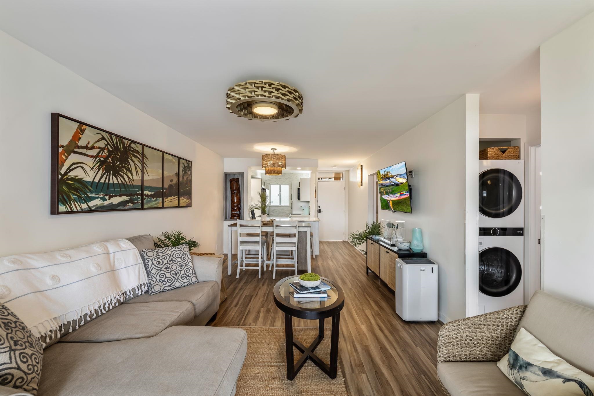 760 South Kihei Road, Unit 208 Kihei, HI 96753 - Photo 7 of 30 a living room with furniture and a wooden floor