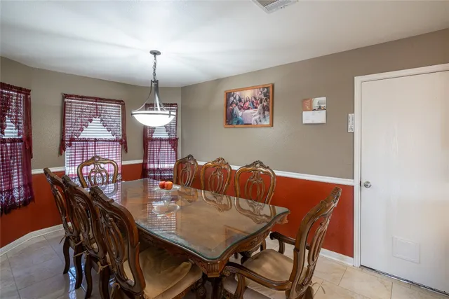a kitchen with a stove a refrigerator and a sink