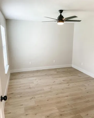 a view of a room with rack on the wall and a window