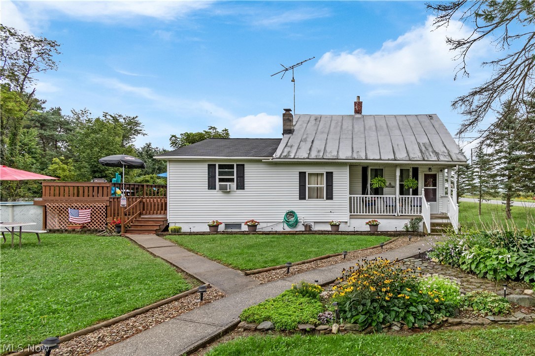 10611 Moss Road Lodi, OH 44254 - Photo 1 of 29 Exterior with partial metal roof and cozy front porch