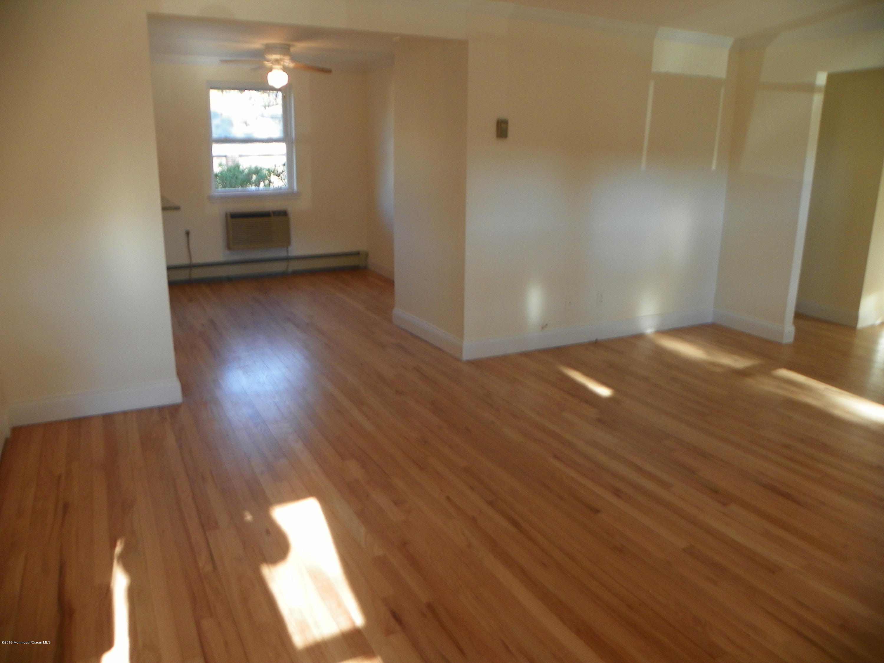 6 Manor Drive Red Bank, NJ 07701 - Photo 13 of 13 wooden floor in an empty room with a window