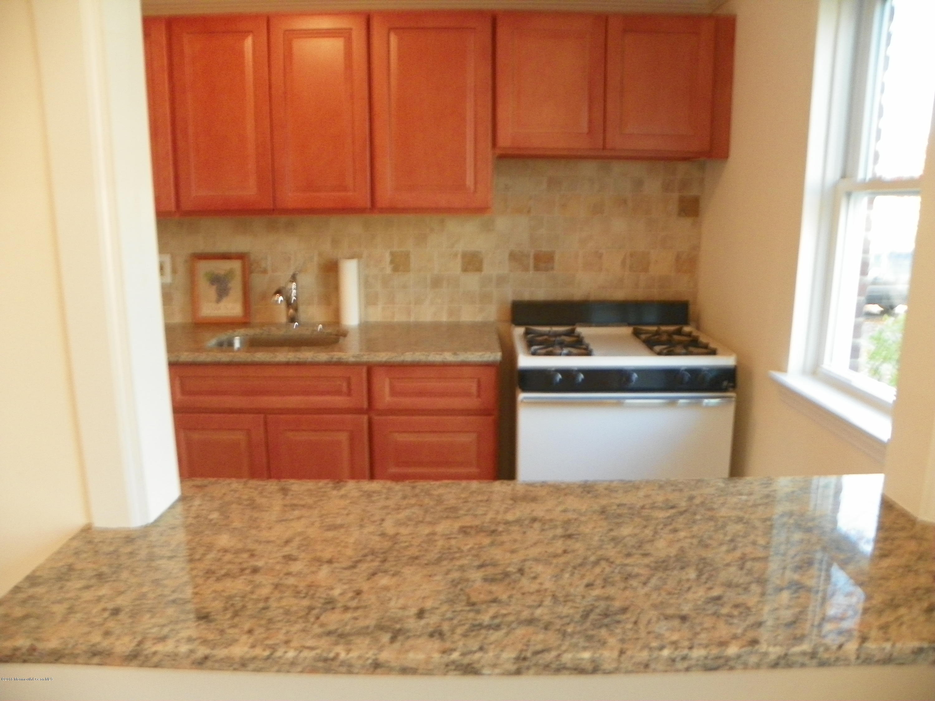 6 Manor Drive Red Bank, NJ 07701 - Photo 5 of 13 a kitchen with a sink and cabinets