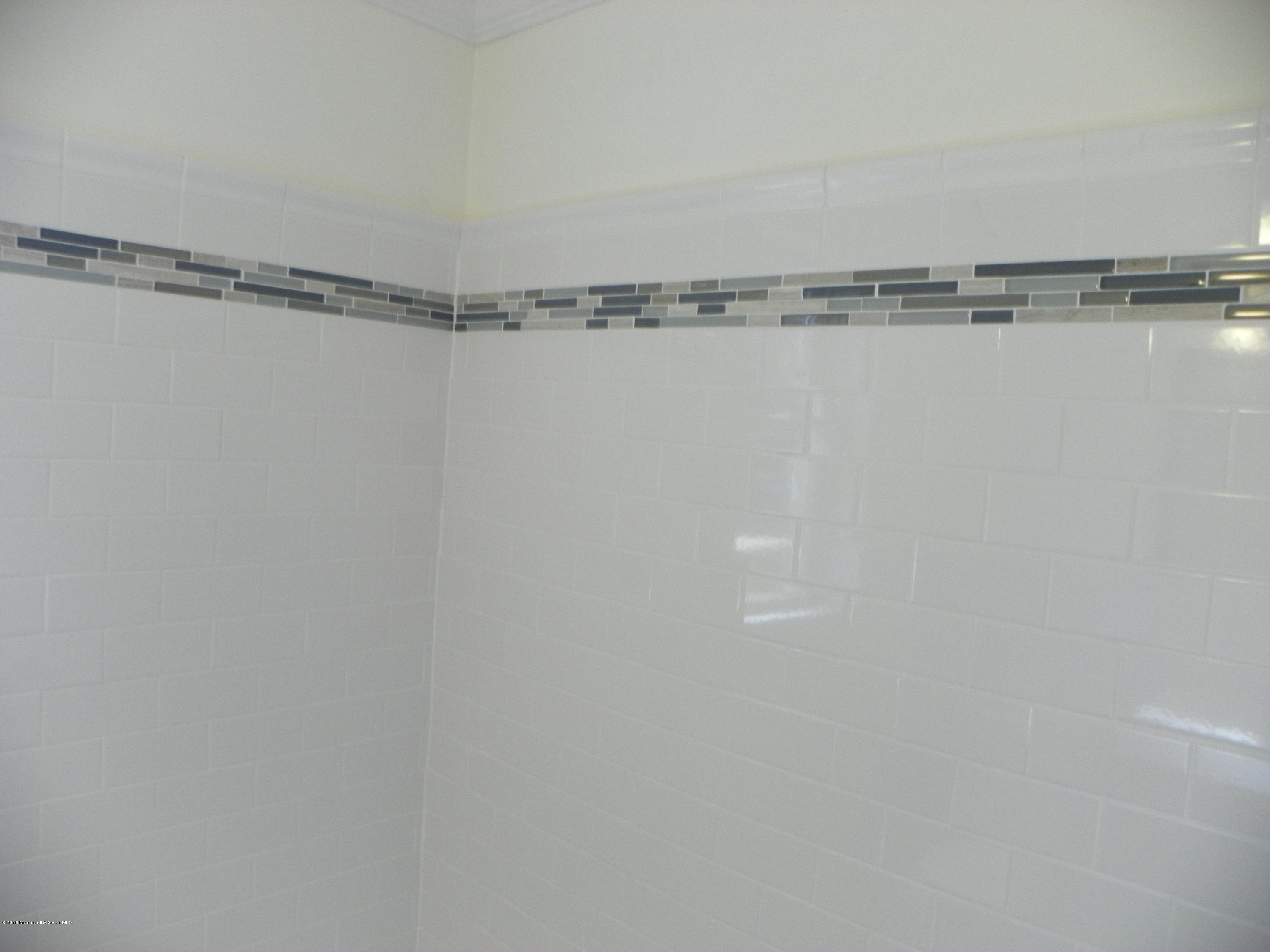 6 Manor Drive Red Bank, NJ 07701 - Photo 9 of 13 a view of a room with racks on the wall