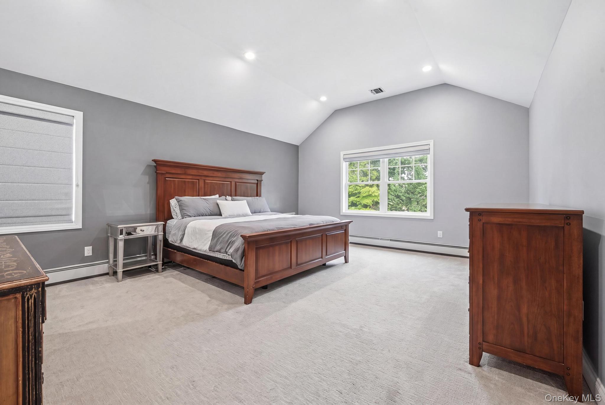 19 Sunset Road West Albertson, NY 11507 - Photo 14 of 24 Room with vaulted ceiling, recessed lighting, and light-toned carpeting