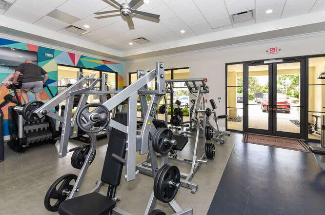 6950 Northwest 26th Way Boca Raton, FL 33496 - Photo 14 of 16 a view of a room with gym equipment