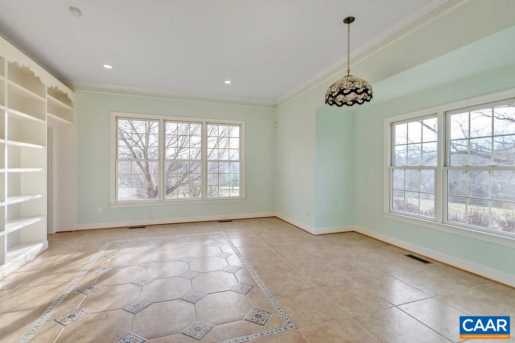 4460 Ivy Road Charlottesville, VA 22903 - Photo 11 of 26 Is open to the kitchen. 17 x 17 means this can be much more than a place for your informal eating. Imagine casual seating, too. Note the wonderful natural light. End wall faces east for glorious morning sun.