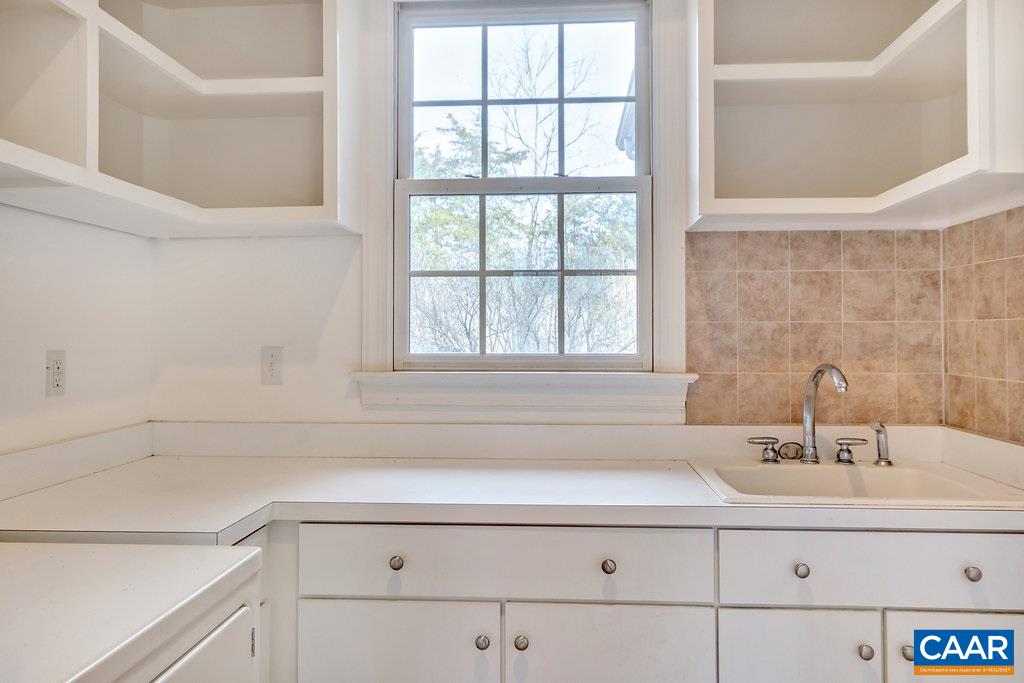 4460 Ivy Road Charlottesville, VA 22903 - Photo 18 of 26 First floor laundry has loads of storage space and pleasant natural light.