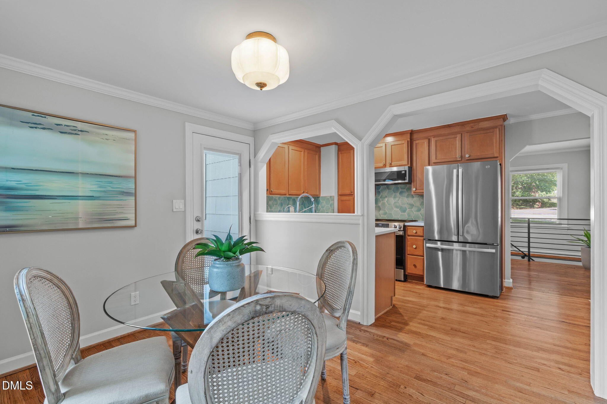 728 Brighton Road Raleigh, NC 27610 - Photo 10 of 38 Sized to fit a variety of dining sets, arched doorway and passthrough to kitchen.