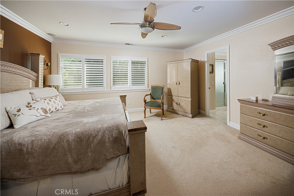 14 Sorenson Irvine, CA 92602 - Photo 16 of 29 a spacious bedroom with a bed and furniture