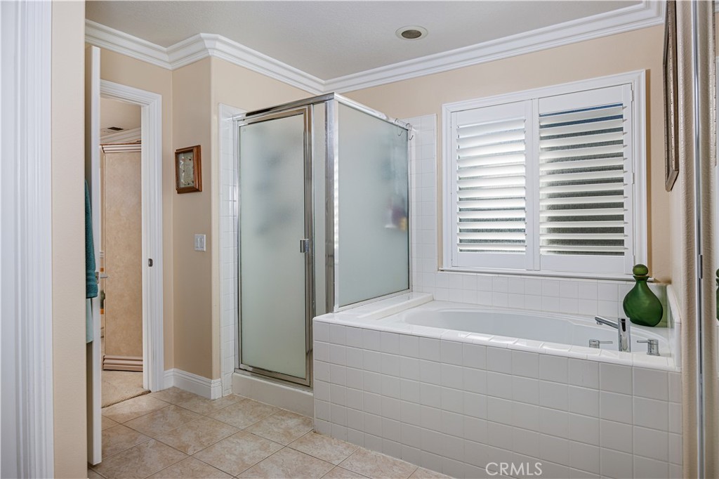 14 Sorenson Irvine, CA 92602 - Photo 20 of 29 a bathroom with a bathtub and shower