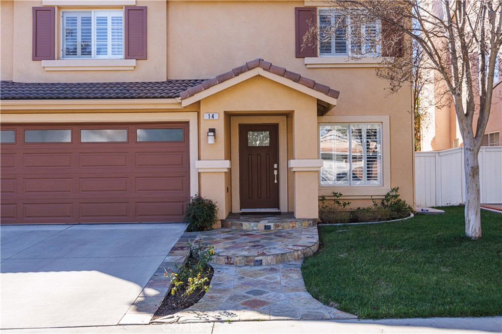 14 Sorenson Irvine, CA 92602 - Photo 2 of 27 a front view of a house with garden